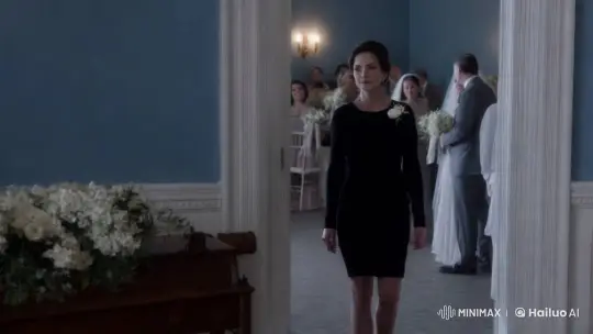 A woman dressed in black steps into a wedding hall that feels suspended in time.  by Hailuo AI Video Generator