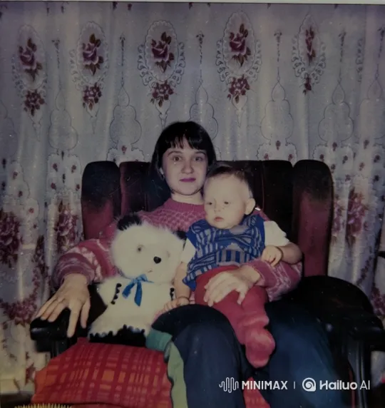 mother and son looking at camera and smiling mother kissing child by Hailuo AI Video Generator
